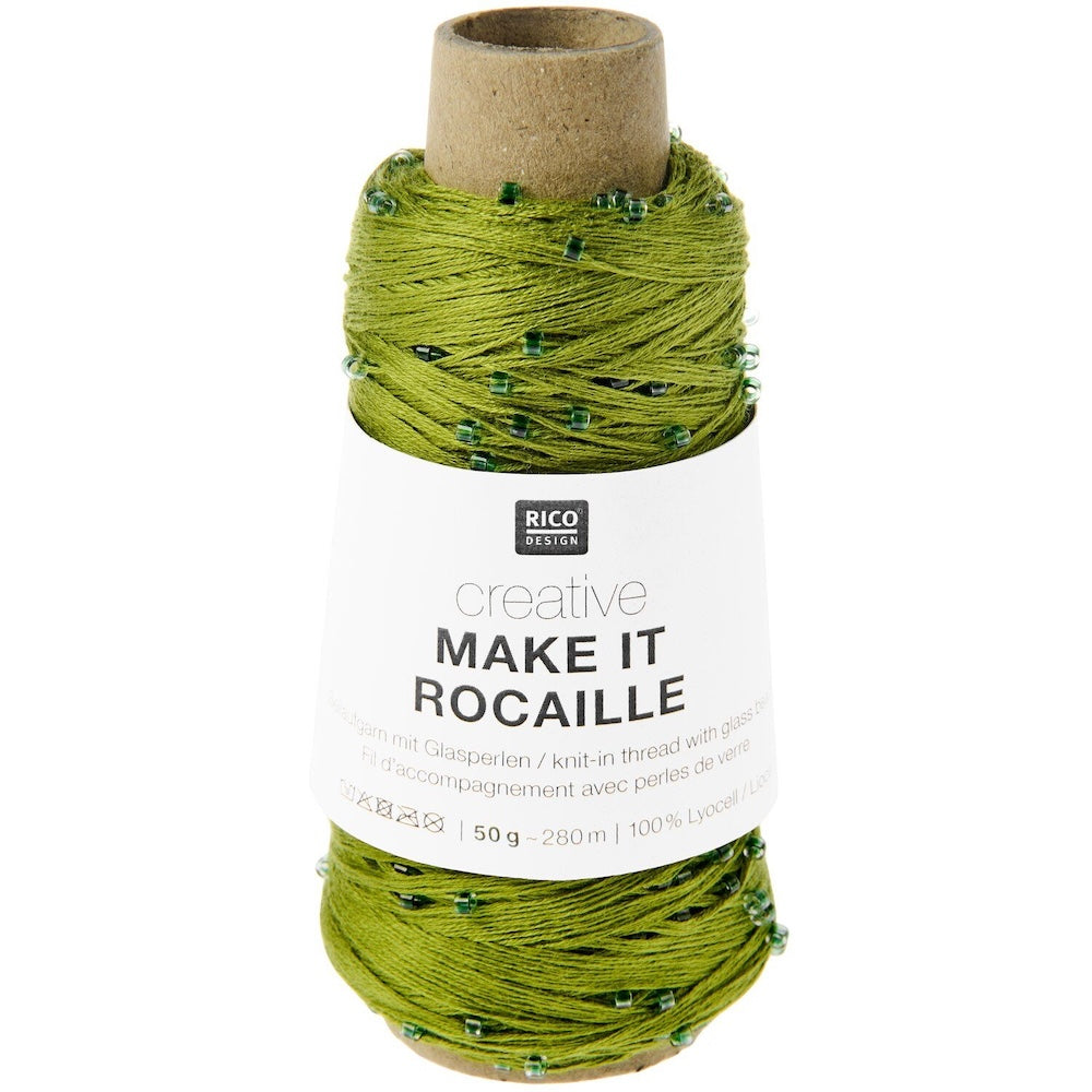 A spool of Rico Design creative knitted thread in olive green with small green beads, on a white background.